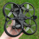 The DJI Avata being held upside-down.